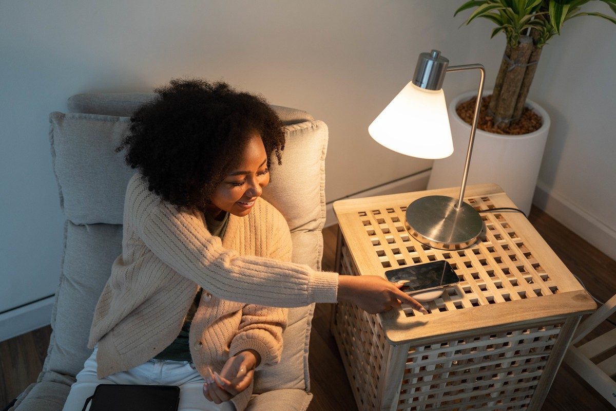 Woman putting her smartphone on wireless charger