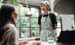 Waitress talking to customer